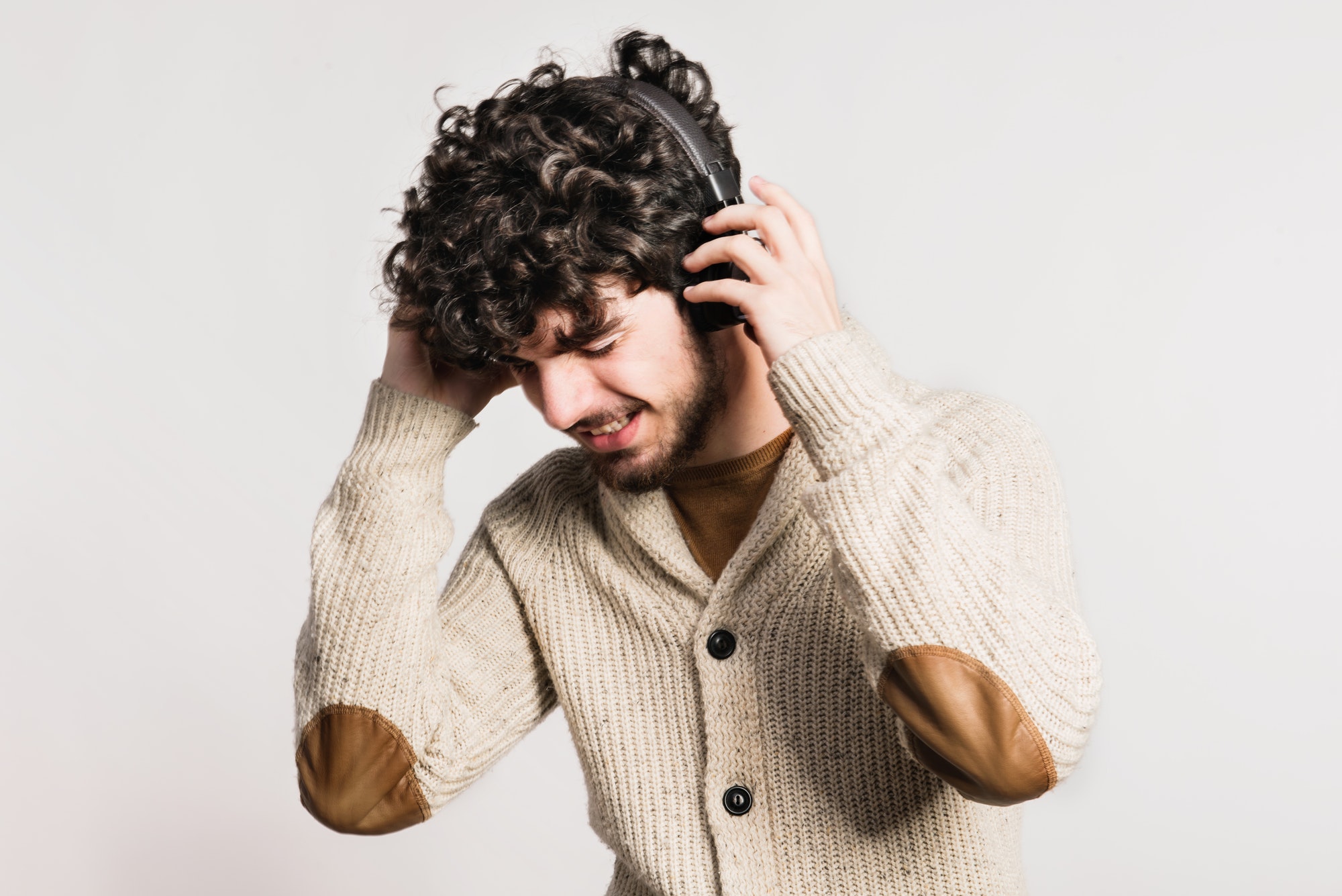 portrait-of-a-young-man-with-headphones-in-a-studio-.jpg